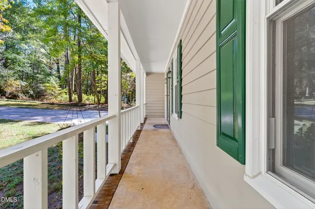 a view of a balcony with wooden floor