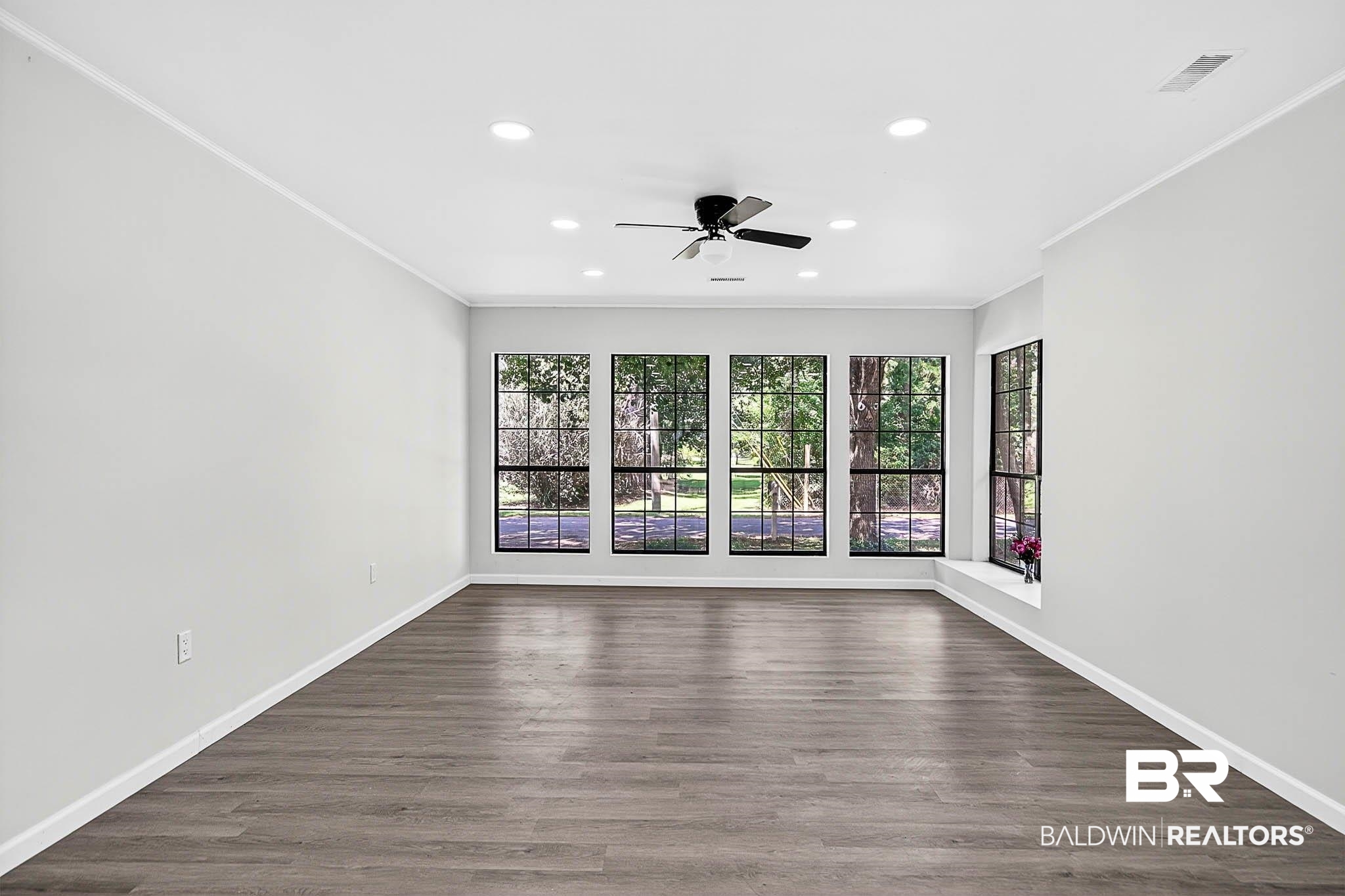 101 Terry Avenue Brewton, AL 36426 - Photo 25 of 48 Unfurnished room featuring ornamental molding, dark wood-style flooring, recessed lighting, and a ceiling fan