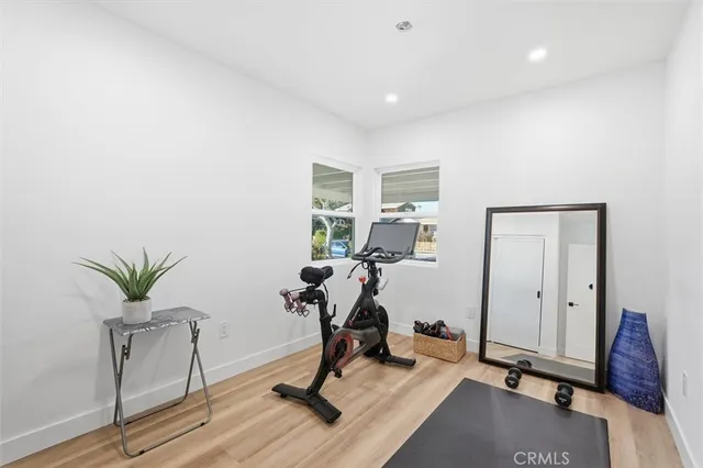 a view of workspace with wooden floor and gym equipment
