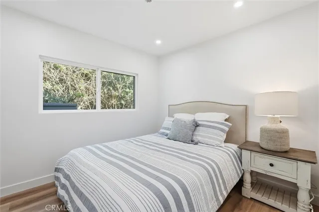 a bedroom with a bed and window