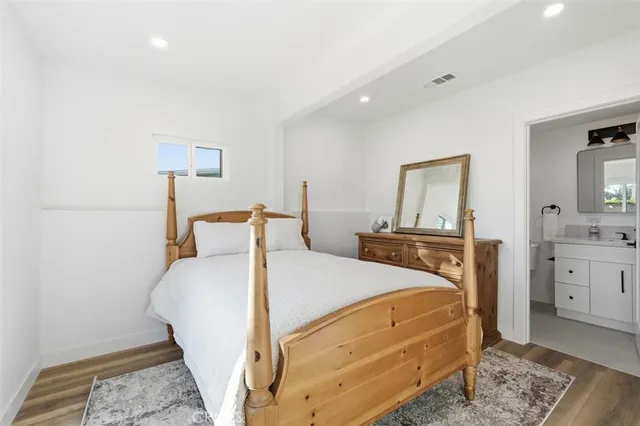 a bed room with a bed and a dresser