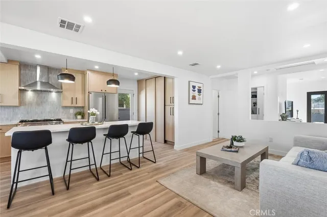 a view of a livingroom with furniture and wooden floor