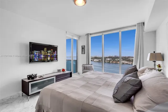 a bedroom with a bed and a couch