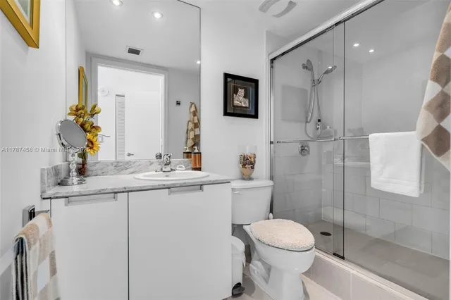 a bedroom with a bed a desk and chair