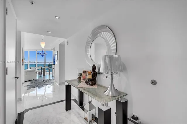 a view of entryway with kitchen and living room