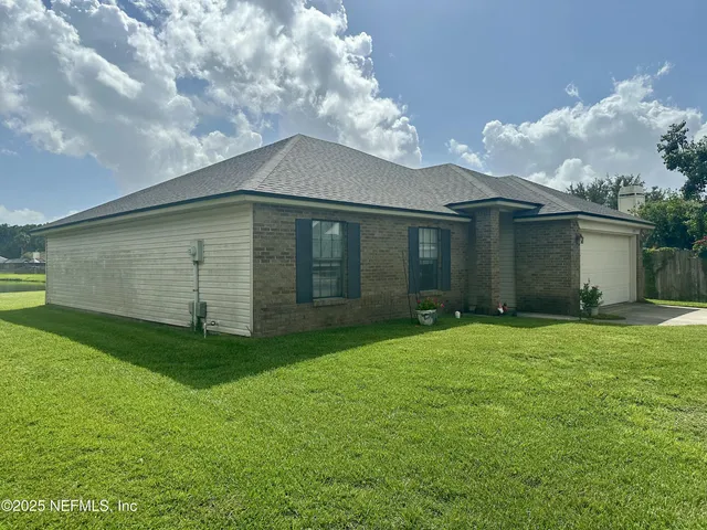 a backyard of a house with lots of green space