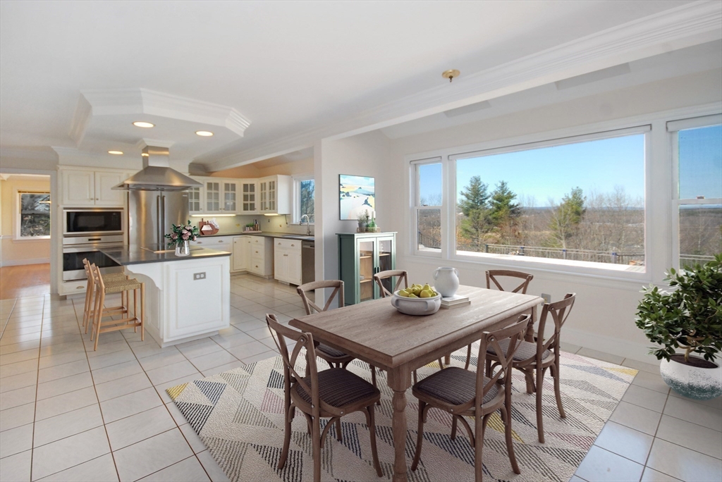 21 Kettle Hole Road Bolton, MA 01740 - Photo 14 of 39 a kitchen with a table and chairs in it