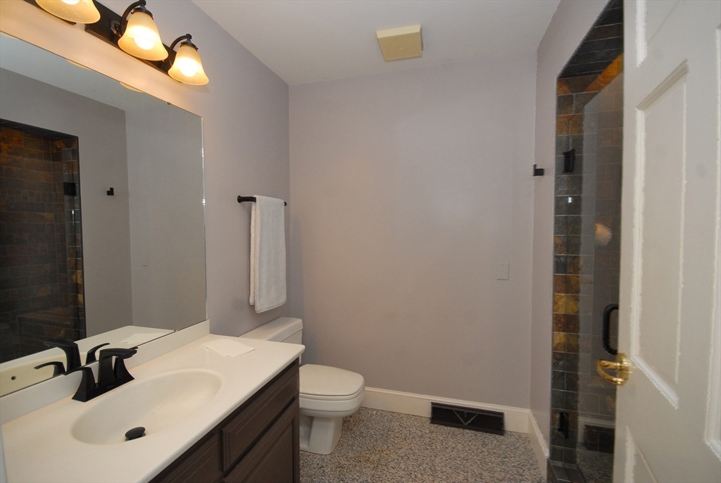 21 Kettle Hole Road Bolton, MA 01740 - Photo 16 of 39 a bathroom with a sink a toilet and shower