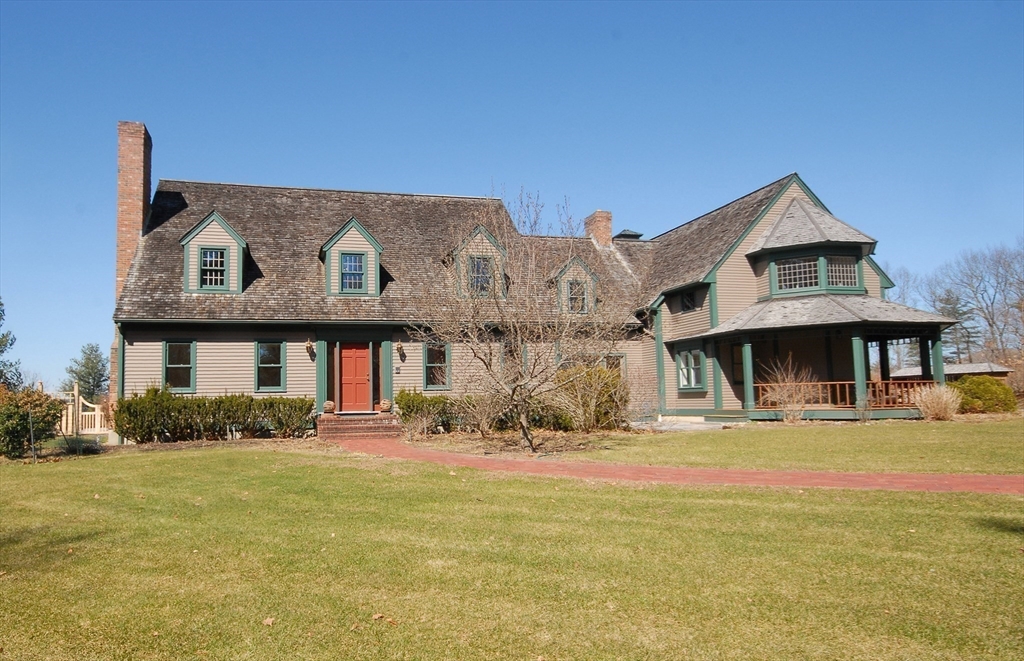 21 Kettle Hole Road Bolton, MA 01740 - Photo 2 of 39 a front view of a house with a yard
