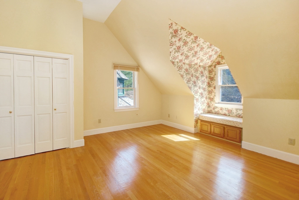21 Kettle Hole Road Bolton, MA 01740 - Photo 23 of 39 a view of an empty room with chandelier fan and wooden floor
