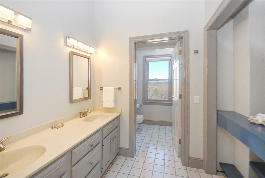 21 Kettle Hole Road Bolton, MA 01740 - Photo 24 of 39 a spacious bathroom with a sink a mirror and a bathtub