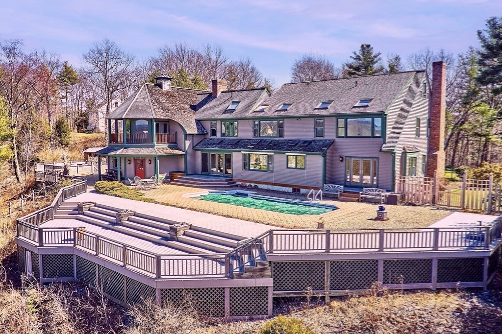 21 Kettle Hole Road Bolton, MA 01740 - Photo 28 of 39 a view of a building with a garden and trees