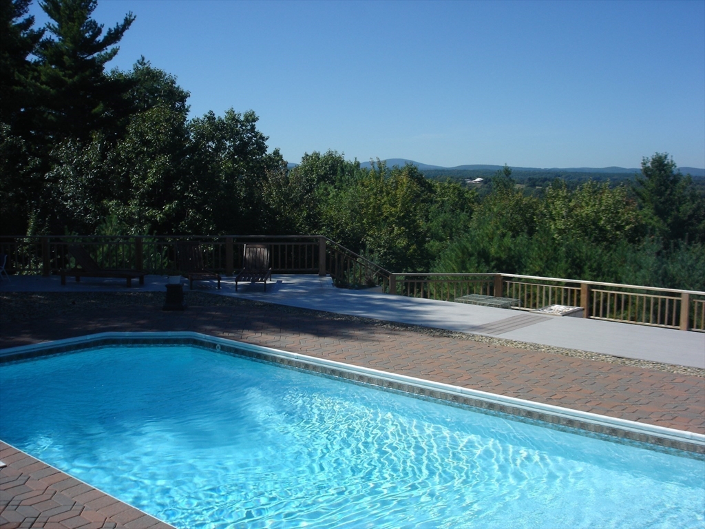21 Kettle Hole Road Bolton, MA 01740 - Photo 3 of 39 a view of a swimming pool with a yard
