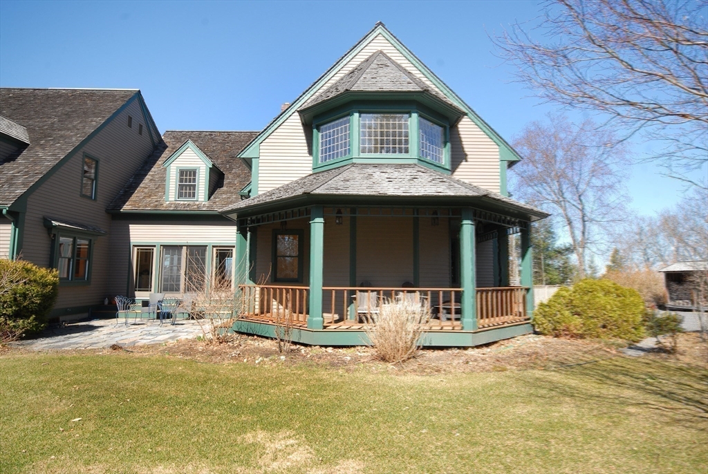 21 Kettle Hole Road Bolton, MA 01740 - Photo 32 of 39 a front view of a house with yard and chairs