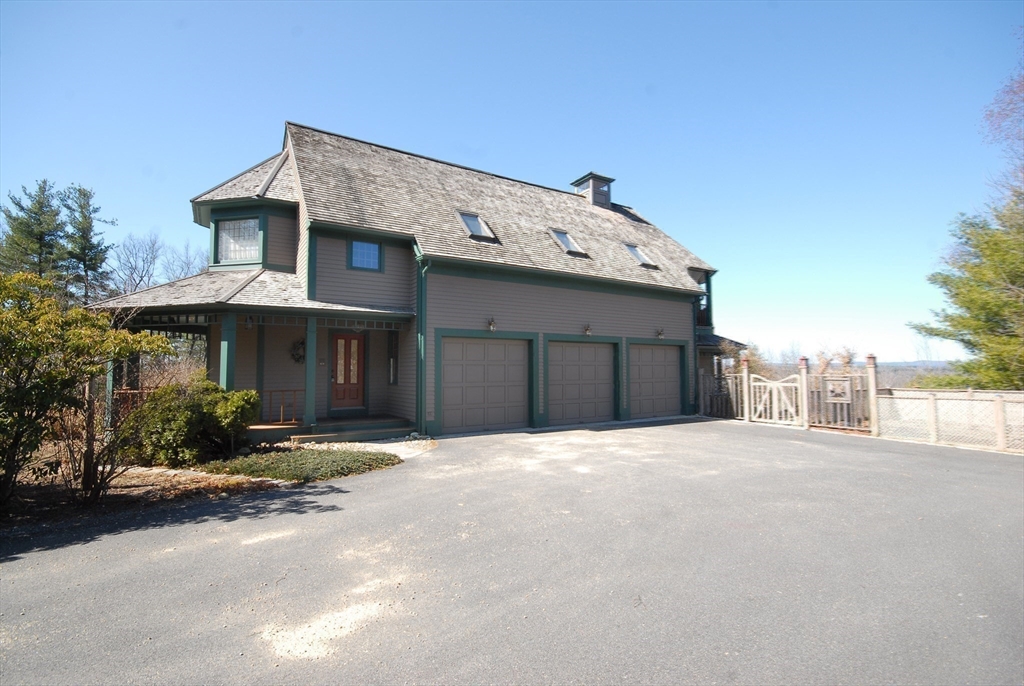 21 Kettle Hole Road Bolton, MA 01740 - Photo 37 of 39 a front view of a house with a yard