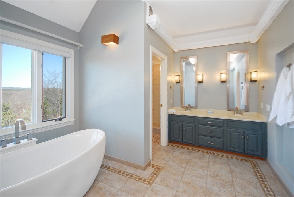 21 Kettle Hole Road Bolton, MA 01740 - Photo 7 of 39 a spacious bathroom with a tub sink and mirror