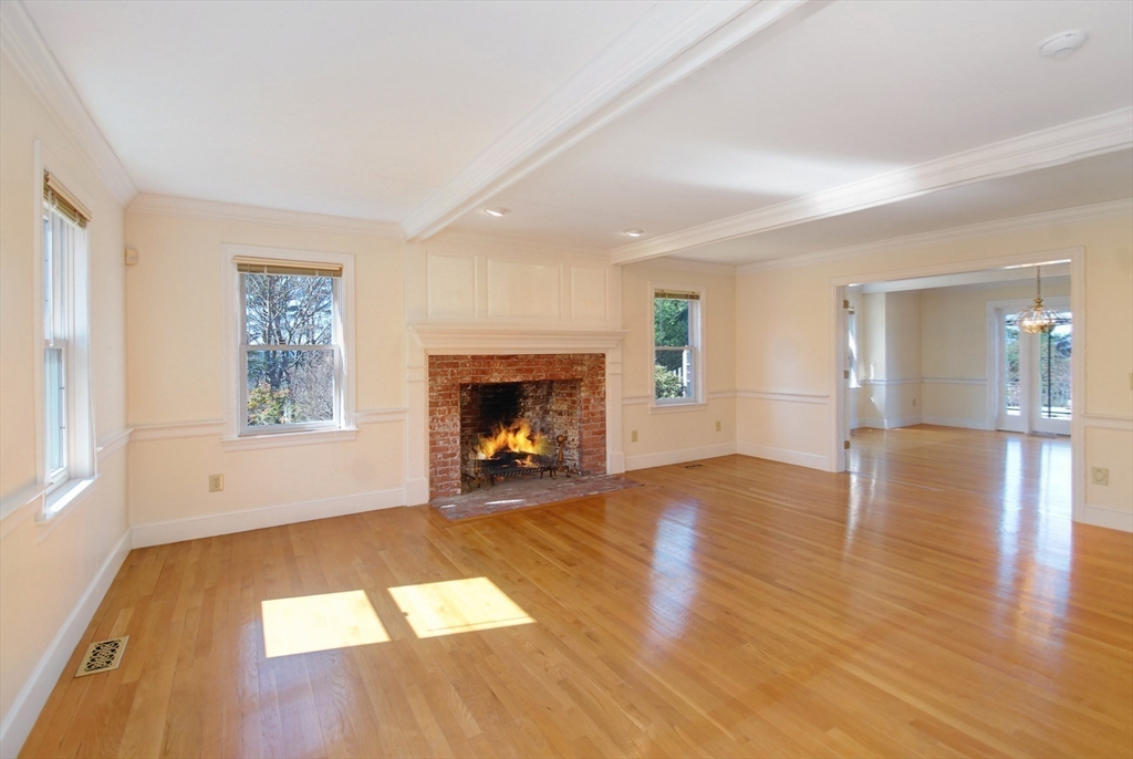 21 Kettle Hole Road Bolton, MA 01740 - Photo 9 of 39 a view of empty room with wooden floor and fireplace
