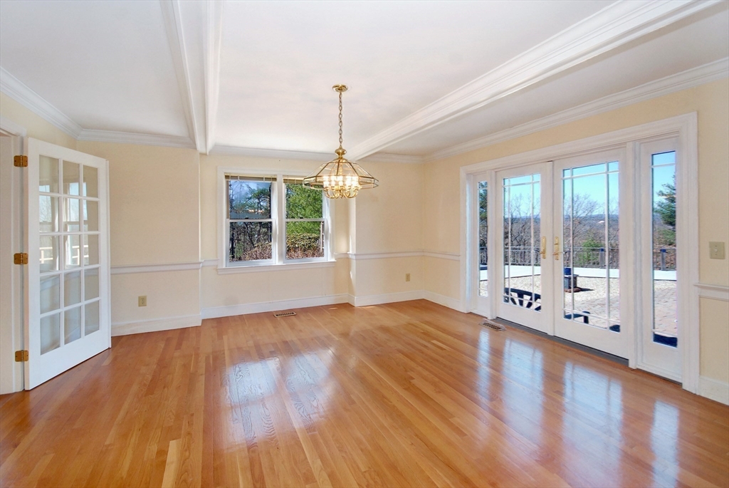 21 Kettle Hole Road Bolton, MA 01740 - Photo 10 of 39 a view of an empty room with wooden floor and a window