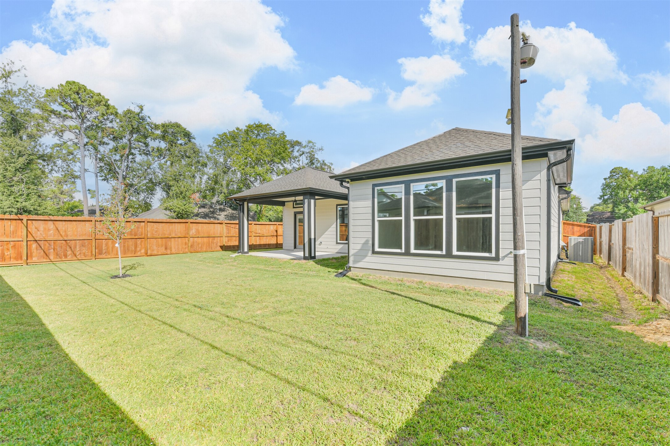 2643 Dalview Street Houston, TX 77091 - Photo 3 of 12 a view of a house with a backyard and a patio