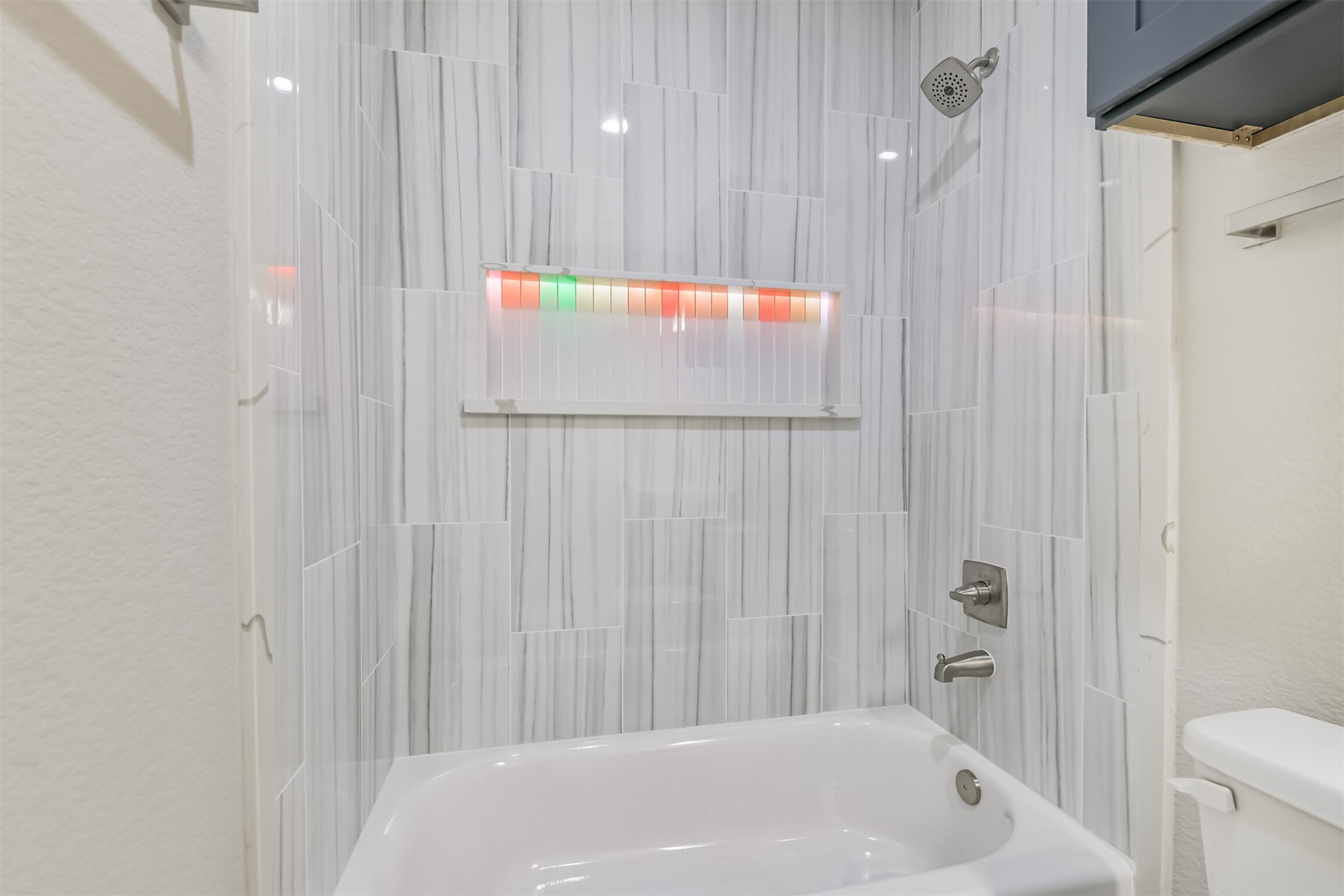 2643 Dalview Street Houston, TX 77091 - Photo 6 of 12 a bathroom with a white bath tub and a shower curtain