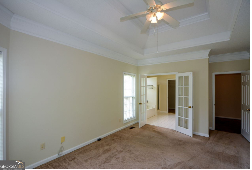 102 Buell Jones Road Carrollton, GA 30117 - Photo 11 of 27 an empty room with closet and a chandelier fan