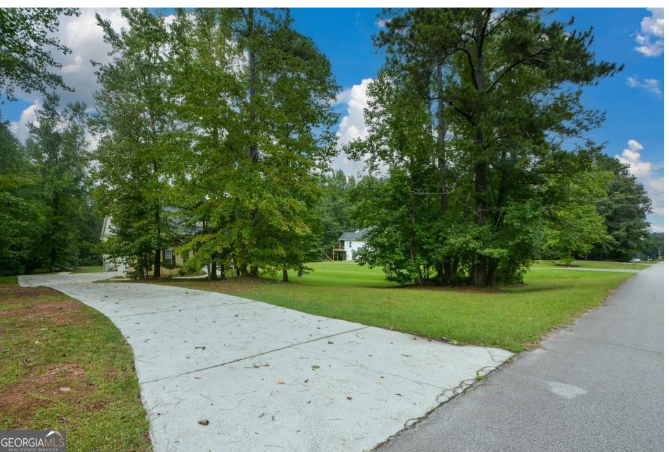 102 Buell Jones Road Carrollton, GA 30117 - Photo 13 of 27 a view of a park with trees and flowers