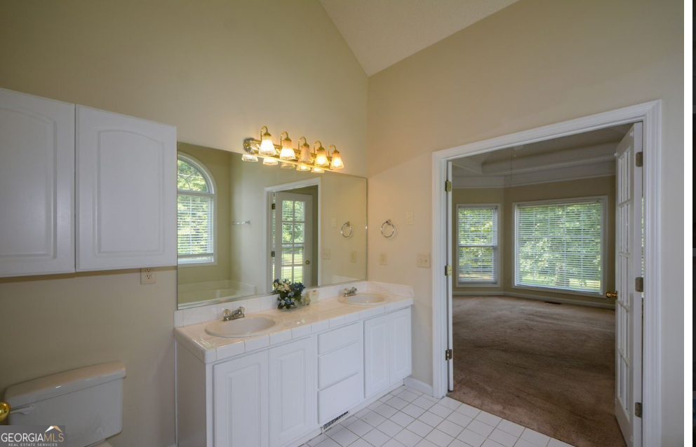 102 Buell Jones Road Carrollton, GA 30117 - Photo 18 of 27 a bathroom with a sink and a mirror