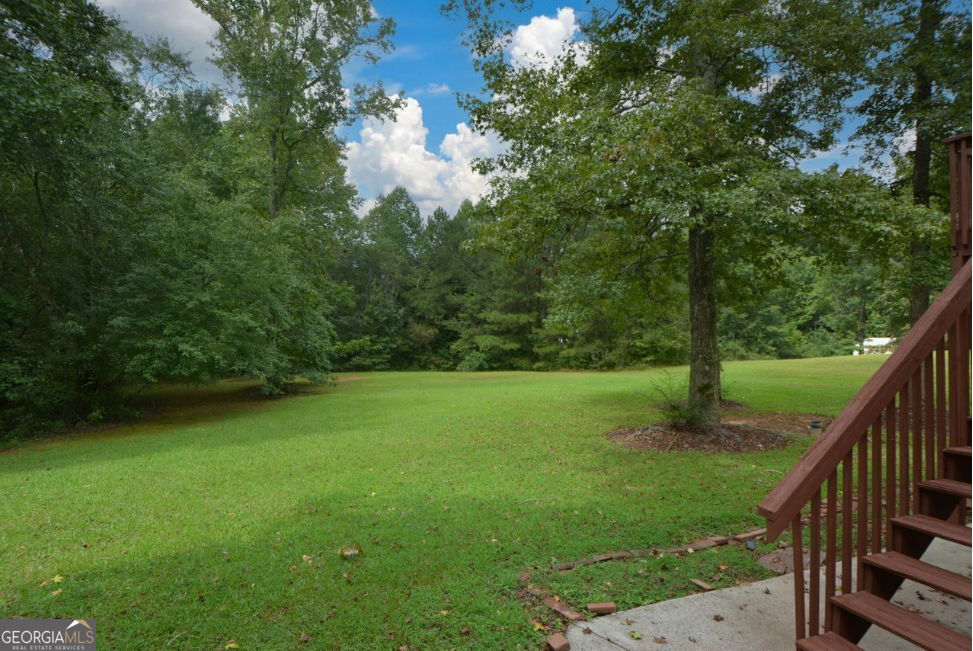 102 Buell Jones Road Carrollton, GA 30117 - Photo 23 of 27 a view of a field of grass and trees