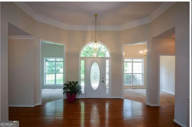a view of entryway with wooden floor