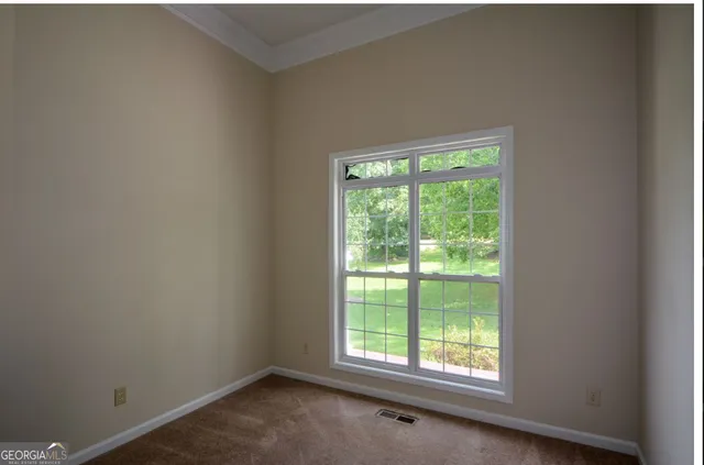 a view of a room that has a window in it