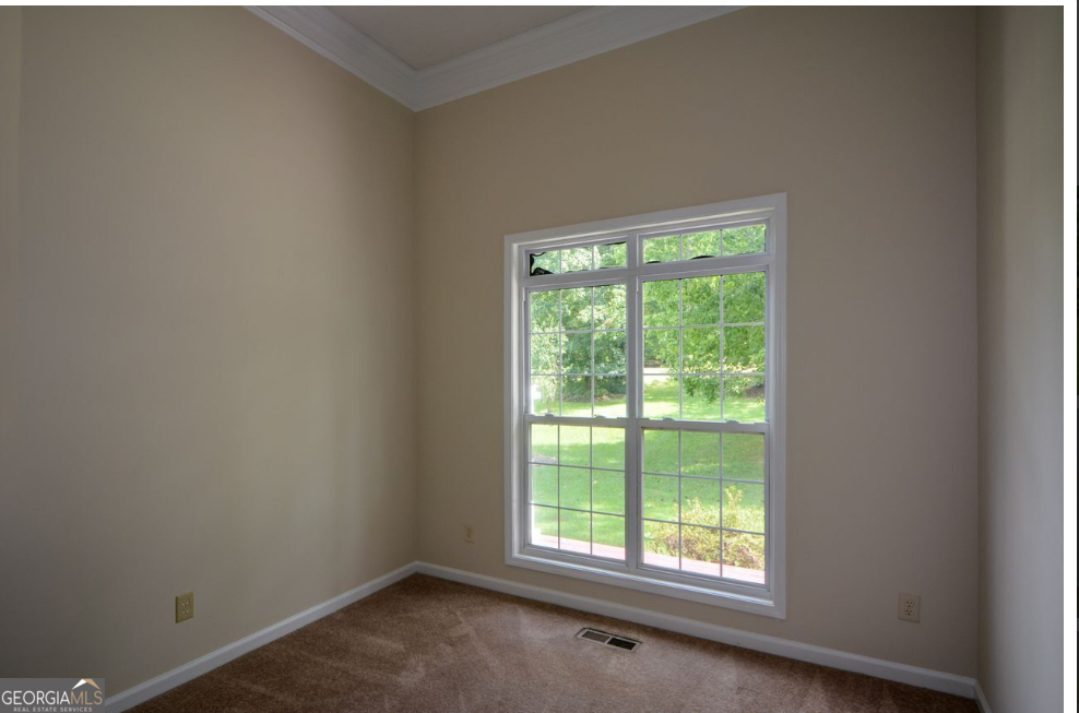 102 Buell Jones Road Carrollton, GA 30117 - Photo 9 of 27 a view of a room that has a window in it