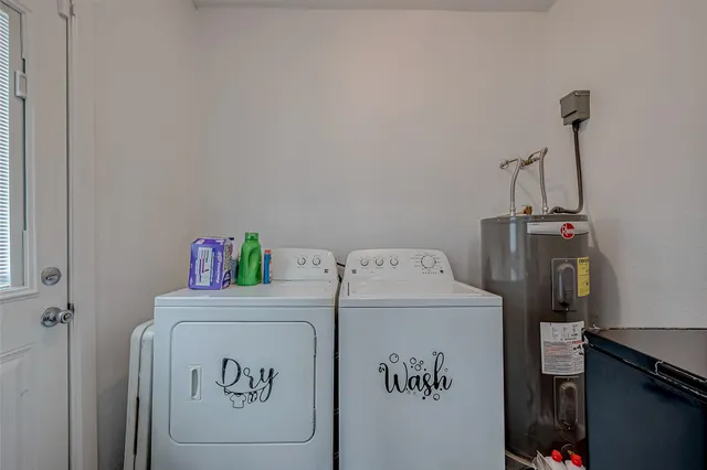 a utility room with dryer and washer