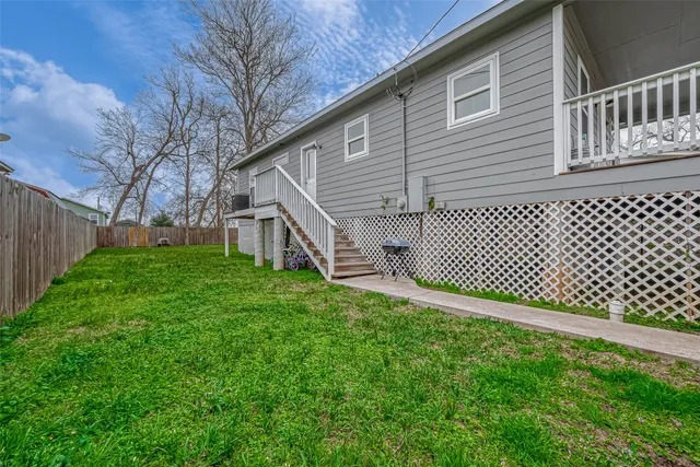a backyard of a house with lots of green space