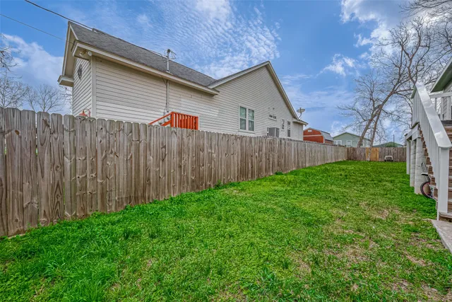 a backyard of a house with lots of green space