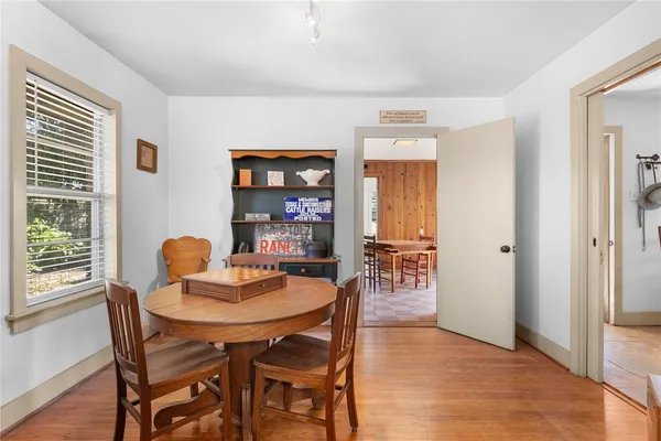 a dining room with furniture and window