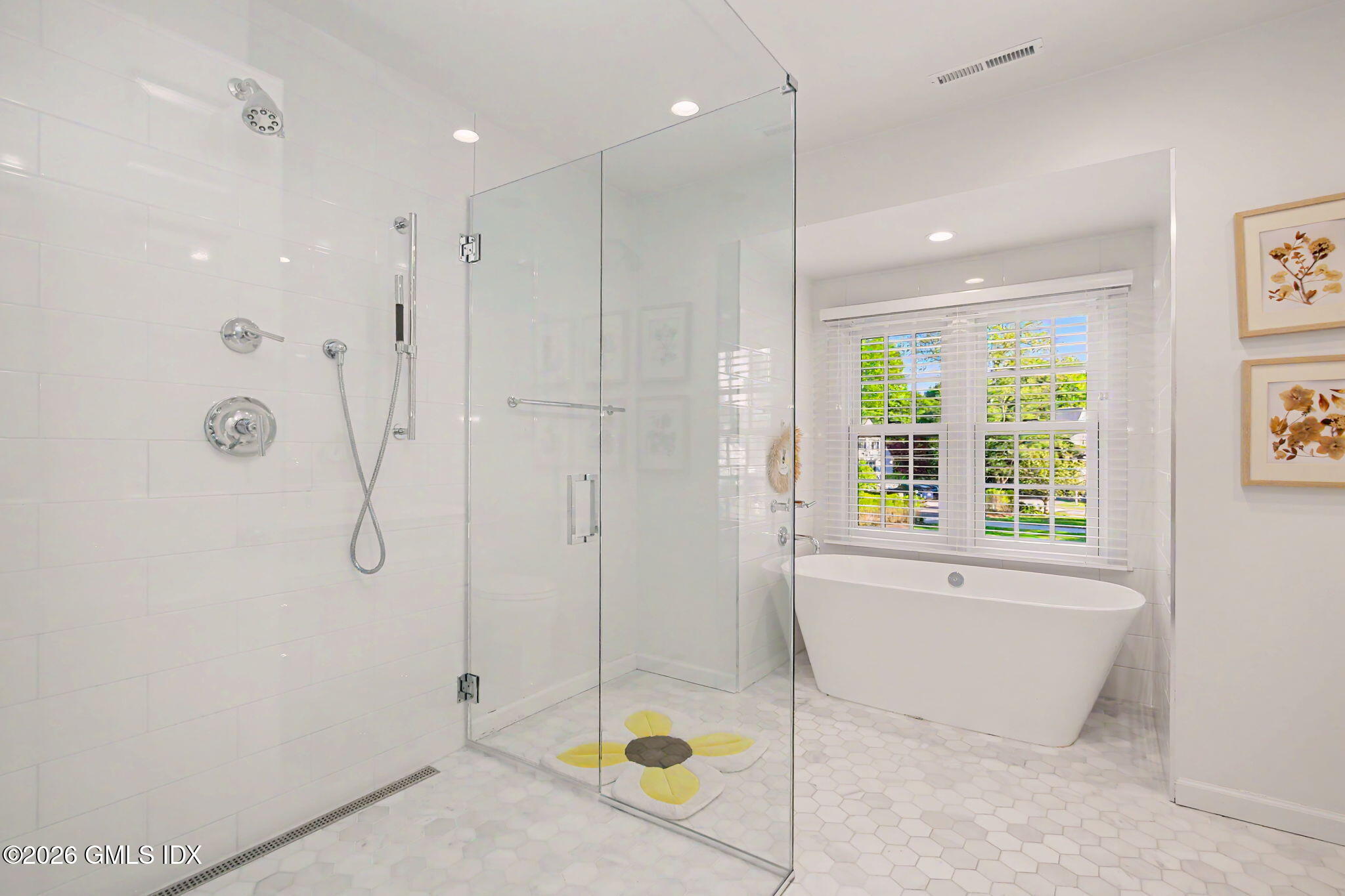 10 Newton Street Riverside, CT 06878 - Photo 18 of 28 a bathroom with a tub shower and window