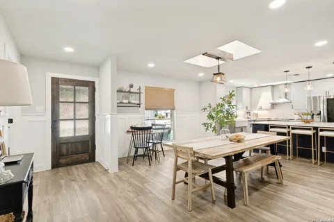 a view of a dining room with furniture and window