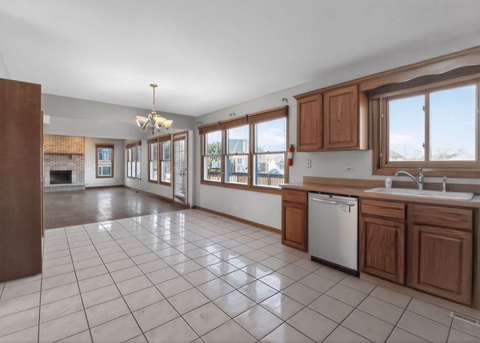 3902 Edgewater Drive Hazel Crest, IL 60429 - Photo 15 of 23 a open kitchen with cabinets a sink appliances and a counter top space