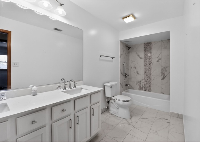 3902 Edgewater Drive Hazel Crest, IL 60429 - Photo 23 of 23 a bathroom with a double vanity sink toilet and shower