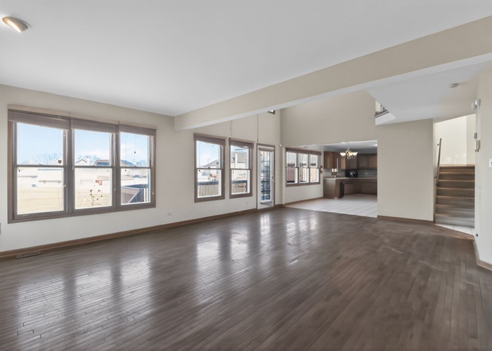 3902 Edgewater Drive Hazel Crest, IL 60429 - Photo 9 of 23 a view of an empty room with a window and wooden floor