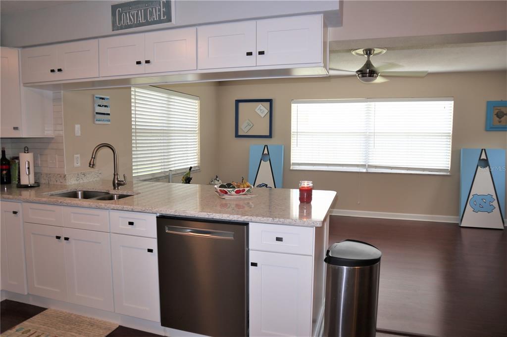 1468 South Evergreen Avenue Clearwater, FL 33756 - Photo 16 of 23 a kitchen with a sink cabinets and window