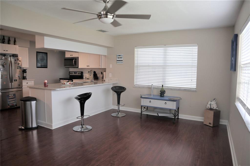 1468 South Evergreen Avenue Clearwater, FL 33756 - Photo 17 of 23 a work room with furniture and windows