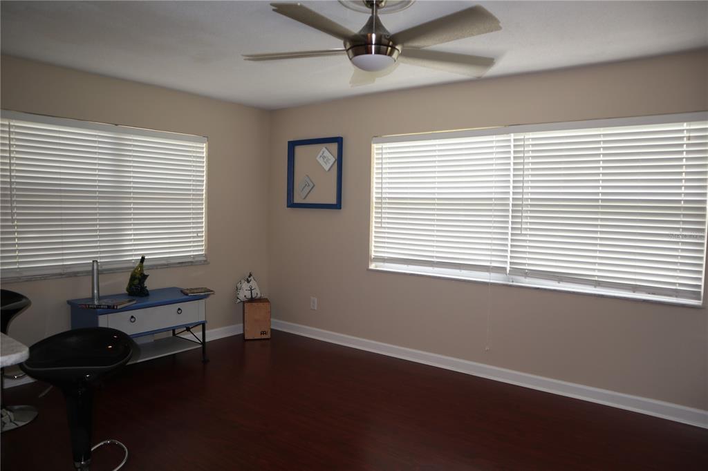 1468 South Evergreen Avenue Clearwater, FL 33756 - Photo 18 of 23 a room that has a window and wooden floor