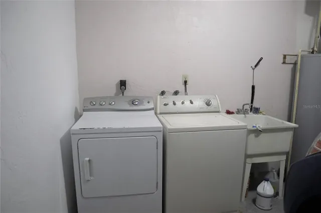 a utility room with dryer and washer