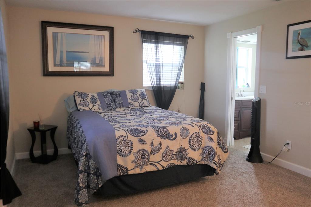 1468 South Evergreen Avenue Clearwater, FL 33756 - Photo 5 of 23 a bedroom with a bed and window