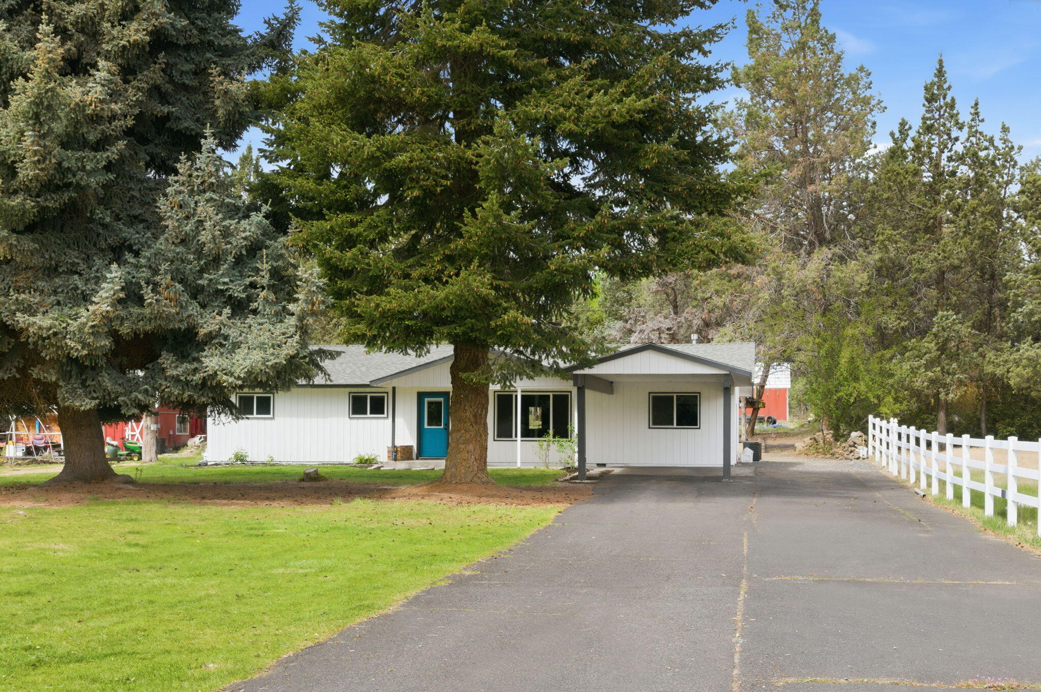 1971 Southwest 25th Street Redmond, OR 97756 - Photo 1 of 30 a front view of a house with a garden