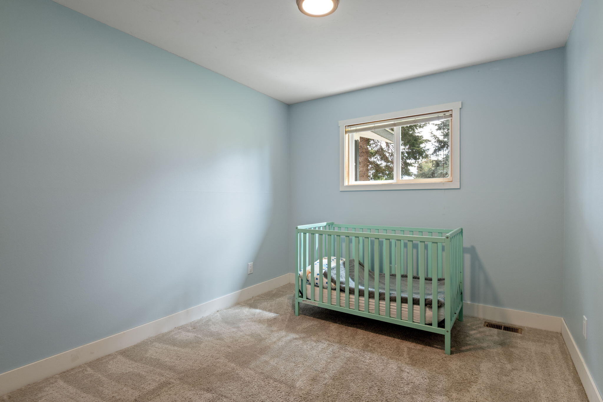 1971 Southwest 25th Street Redmond, OR 97756 - Photo 19 of 30 a view of a room with window a bed and a window