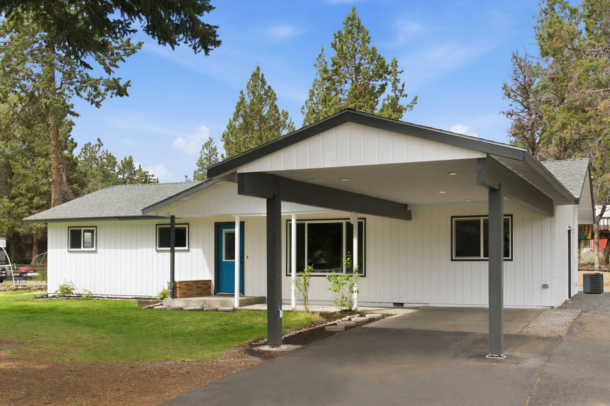 1971 Southwest 25th Street Redmond, OR 97756 - Photo 3 of 30 a house with a yard and front view of a house