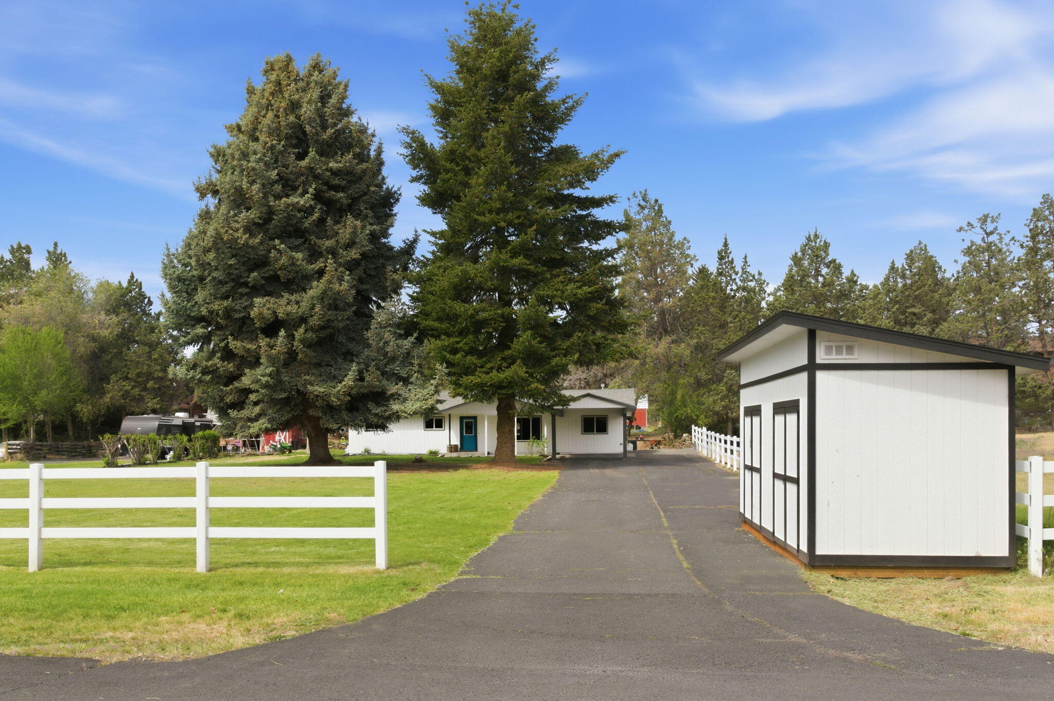 1971 Southwest 25th Street Redmond, OR 97756 - Photo 4 of 30 a front view of a house with a yard