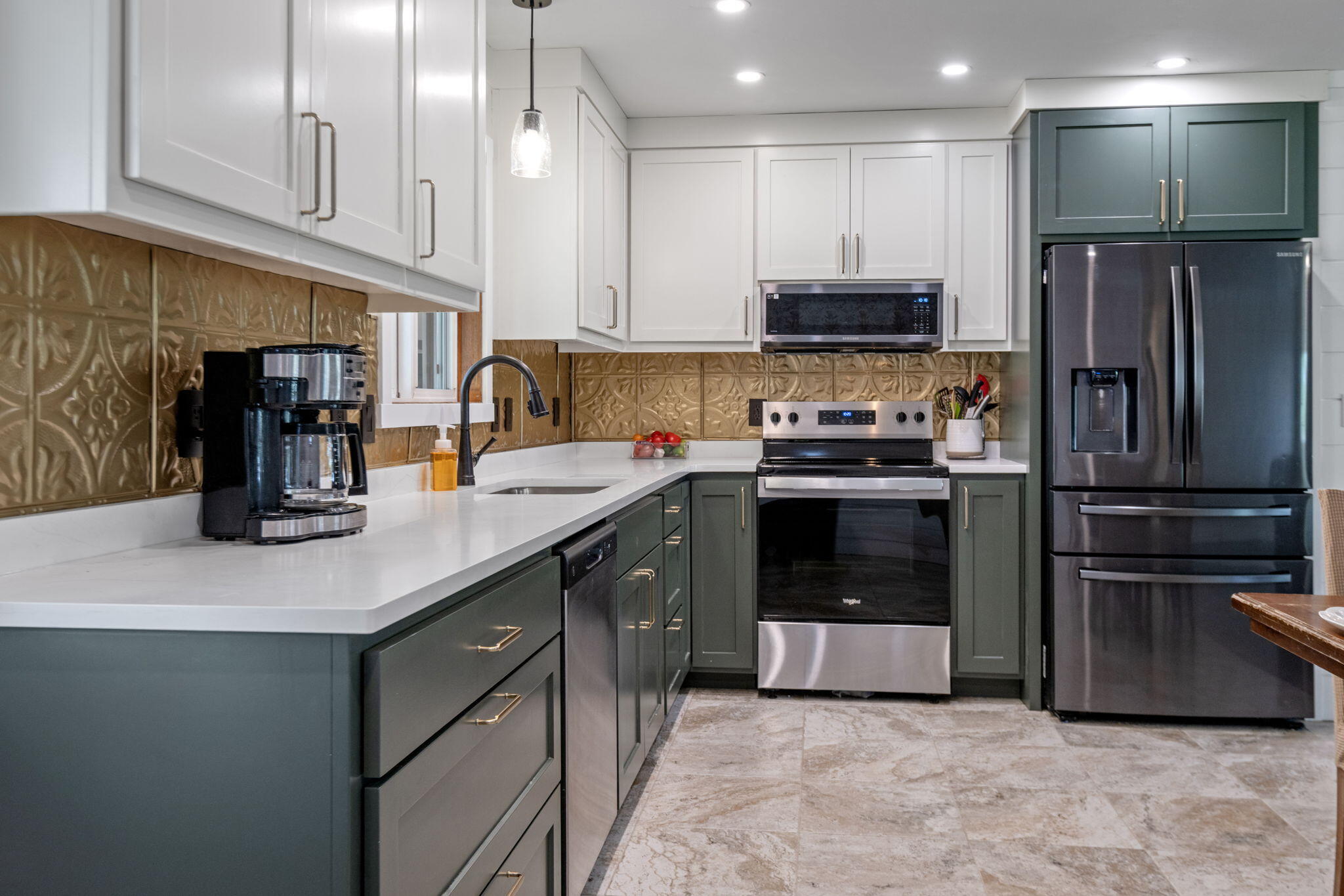 1971 Southwest 25th Street Redmond, OR 97756 - Photo 10 of 30 a kitchen with stainless steel appliances granite countertop a refrigerator a stove and a sink with wooden cabinets